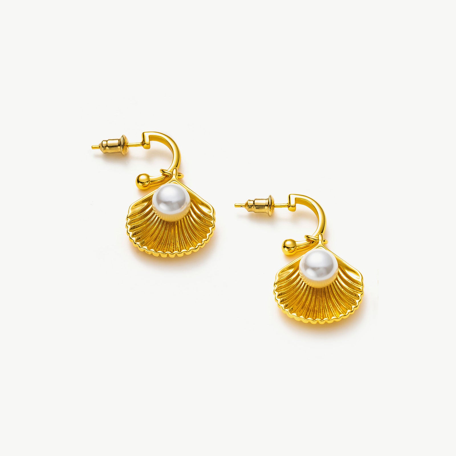 Pearl Shell Hoops, a testament to oceanic elegance, featuring lustrous pearls delicately cradled within intricately designed shell motifs for a touch of seaside refinement