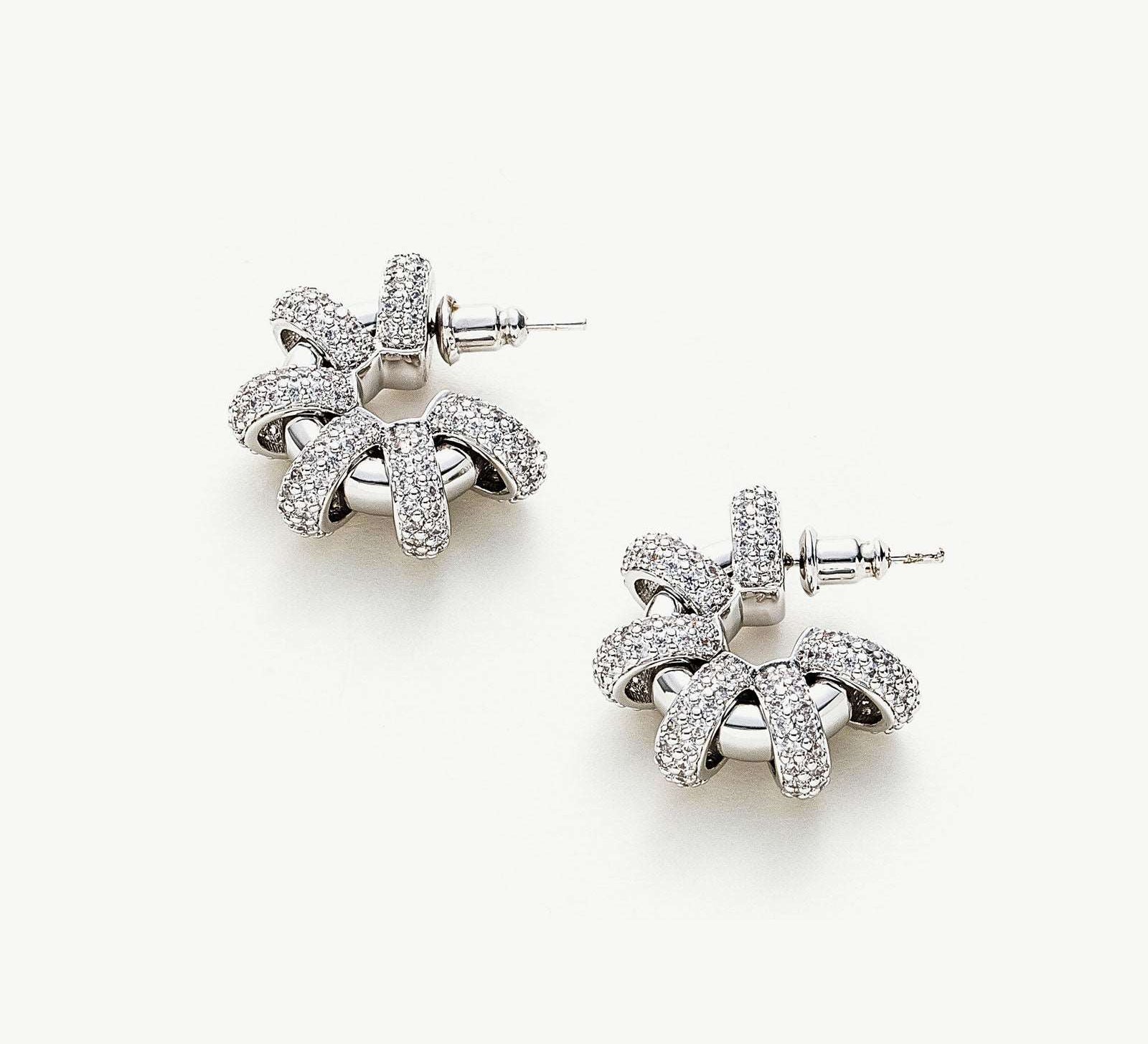 Coiled Single Earrings, featuring a singular coil design, these earrings exude elegance with a modern twist, adding a touch of sophistication to your ear ensemble