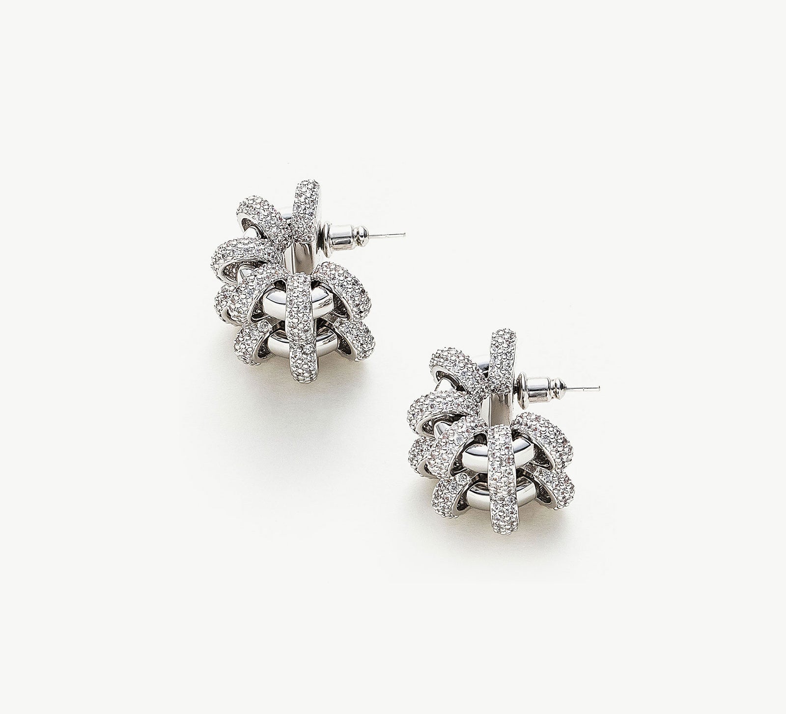 Coiled Double Earrings, showcasing an elegant double coil design, these earrings add a touch of sophistication and modern style to your ear ensemble