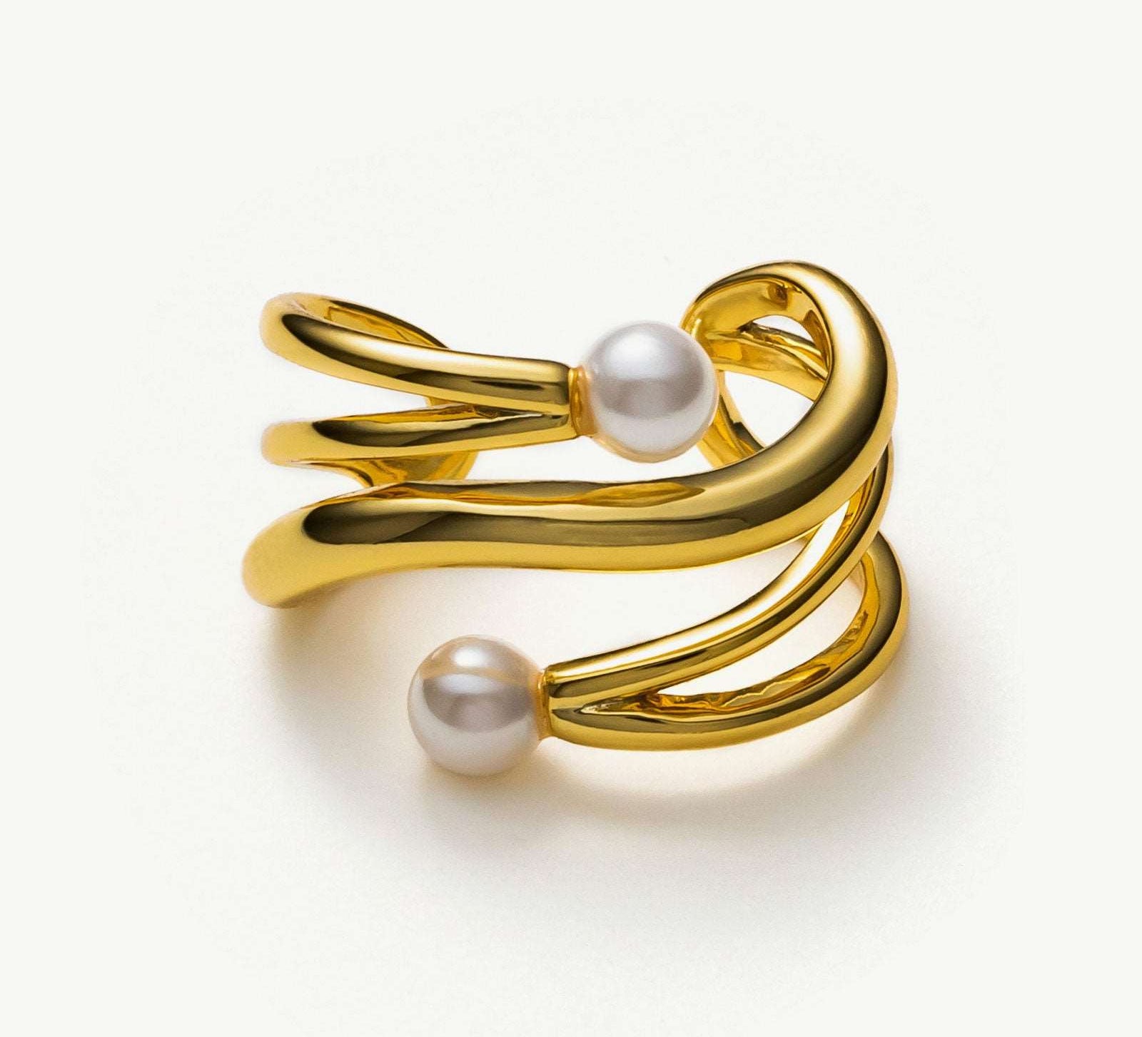 Gold Claw Pearl Ear Cuff, a luxurious and opulent accessory that adds a touch of regal charm to your ear
