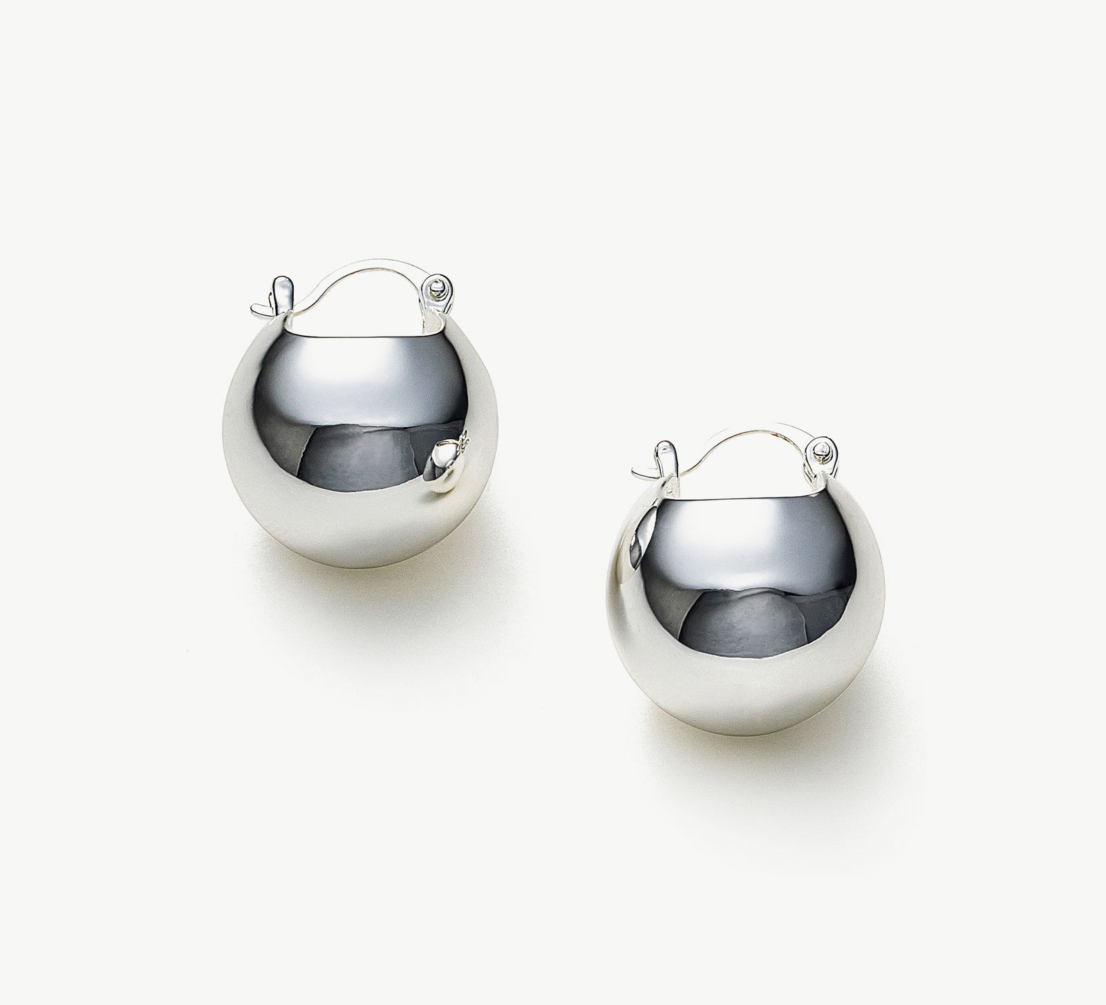 Semiphere Hoop Earrings making sculptural statements with their semiphere design, these earrings add a touch of refined charm to your overall style