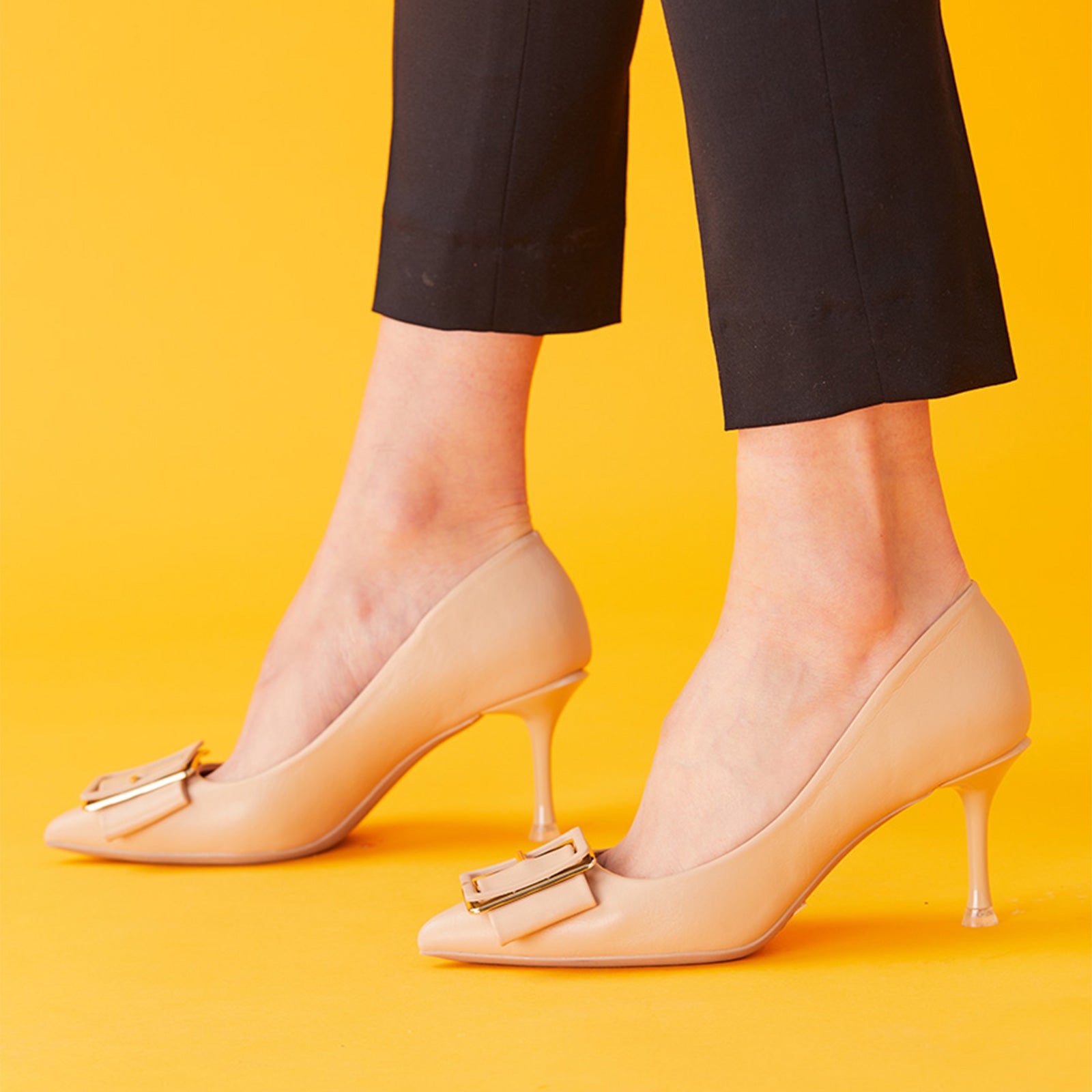 Cityscape Sophistication: Beige Square Buckled Pumps, perfect for a confident and fashionable look in any urban setting.