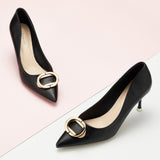Black Metal Buckled Pumps, perfect for a confident and fashionable look in any urban setting