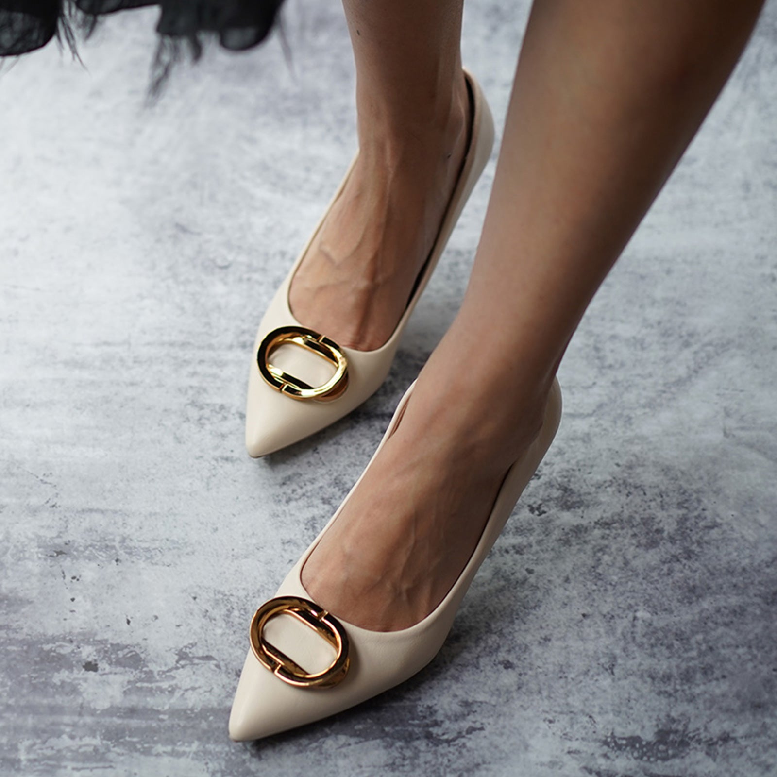 White Women Pumps featuring metal buckles, a timeless and elegant option for any occasion.