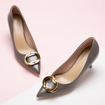 Grey Metal Buckled Women Pumps, a versatile and chic choice for adding a touch of urban sophistication to your ensemble.