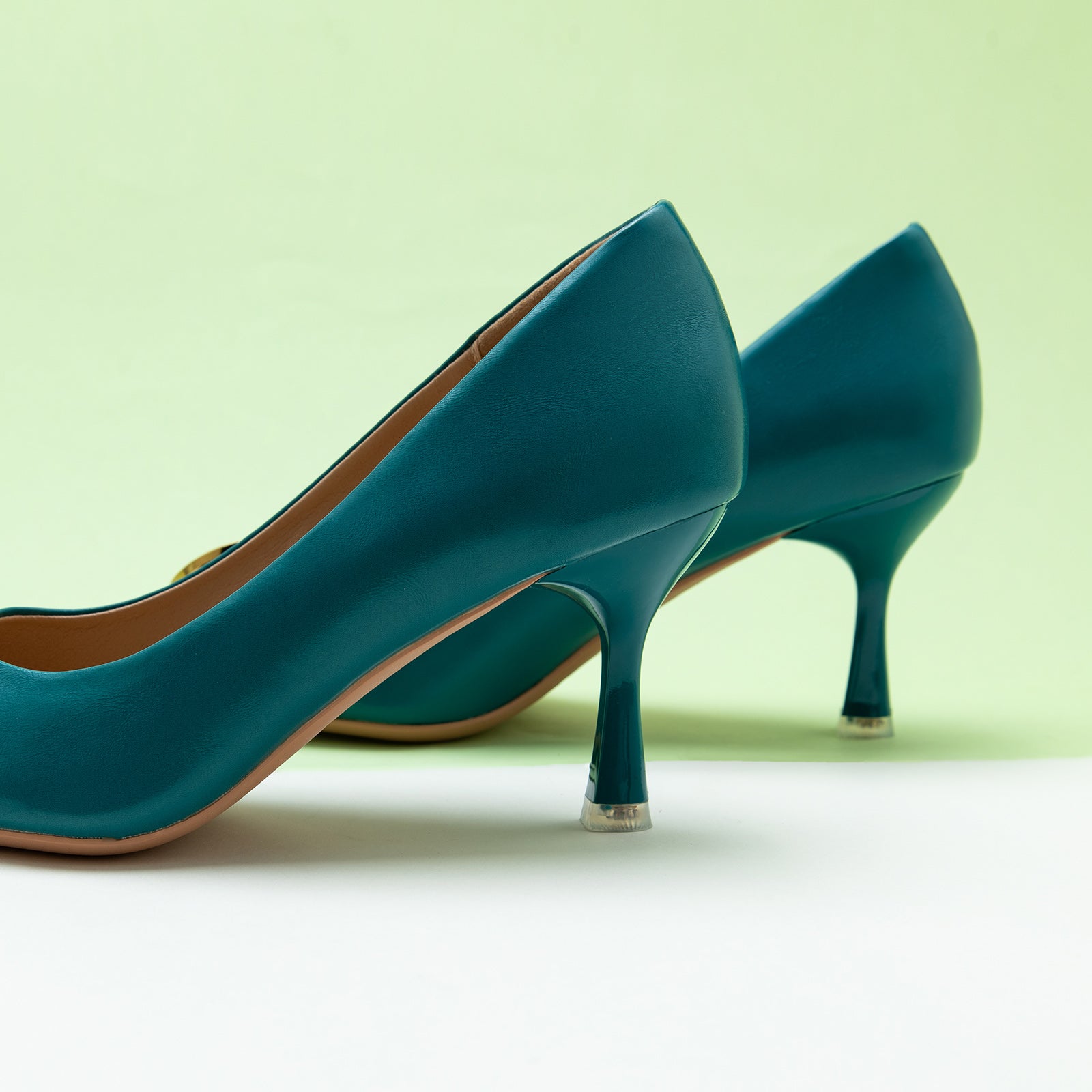 Women Pumps in Peacock Blue with stylish metal buckles, featuring classic details for a polished and opulent style