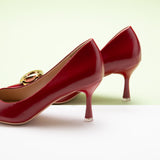 Metal Buckled Women Pumps in Red, combining timeless elegance with a modern twist.
