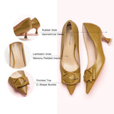 Make a chic statement with these pumps showcasing a kitten heel and a delicate buckle in a straw color, adding a touch of modern comfort to your ensemble