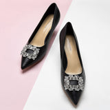 Classic Details: Black Buckle Kitten Heel Pumps with embellishments, a refined and stylish option for both casual and formal occasions