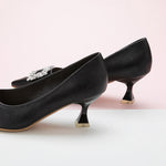 City Chic Charm: Black Embellished Kitten Heel Pumps featuring a decorative buckle, a modern and fashionable addition to your wardrobe