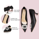 Effortless Grace: Black Buckle Kitten Heel Pumps with subtle embellishments, providing comfort and style in every step