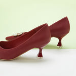 Passionate Red Accents: Embellished Red Kitten Heel Pumps with a stylish buckle, perfect for making a confident and stylish statement