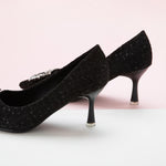 Black Glitter Tweed Pumps adorned with a square buckle, a chic and sophisticated addition to your wardrobe