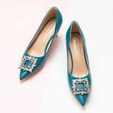 Peacock blue leather pumps with a stunning crystal buckle detail