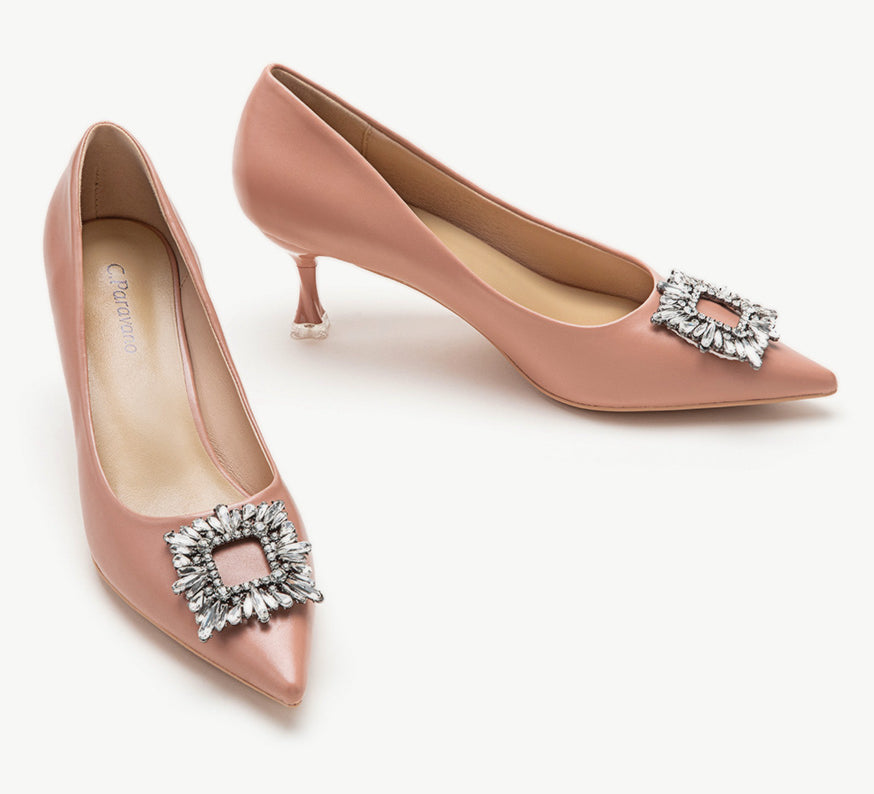 Pink leather pumps with a glamorous crystal buckle embellishment