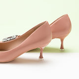 Chic and luxurious pink pumps enhanced by a crystal buckle.
