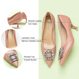 Gorgeous leather pumps in lovely pink, complemented by a crystal buckle