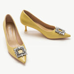 Yellow leather pumps with a stunning crystal buckle embellishment
