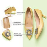 Gorgeous leather pumps in vibrant yellow, complemented by a crystal buckle