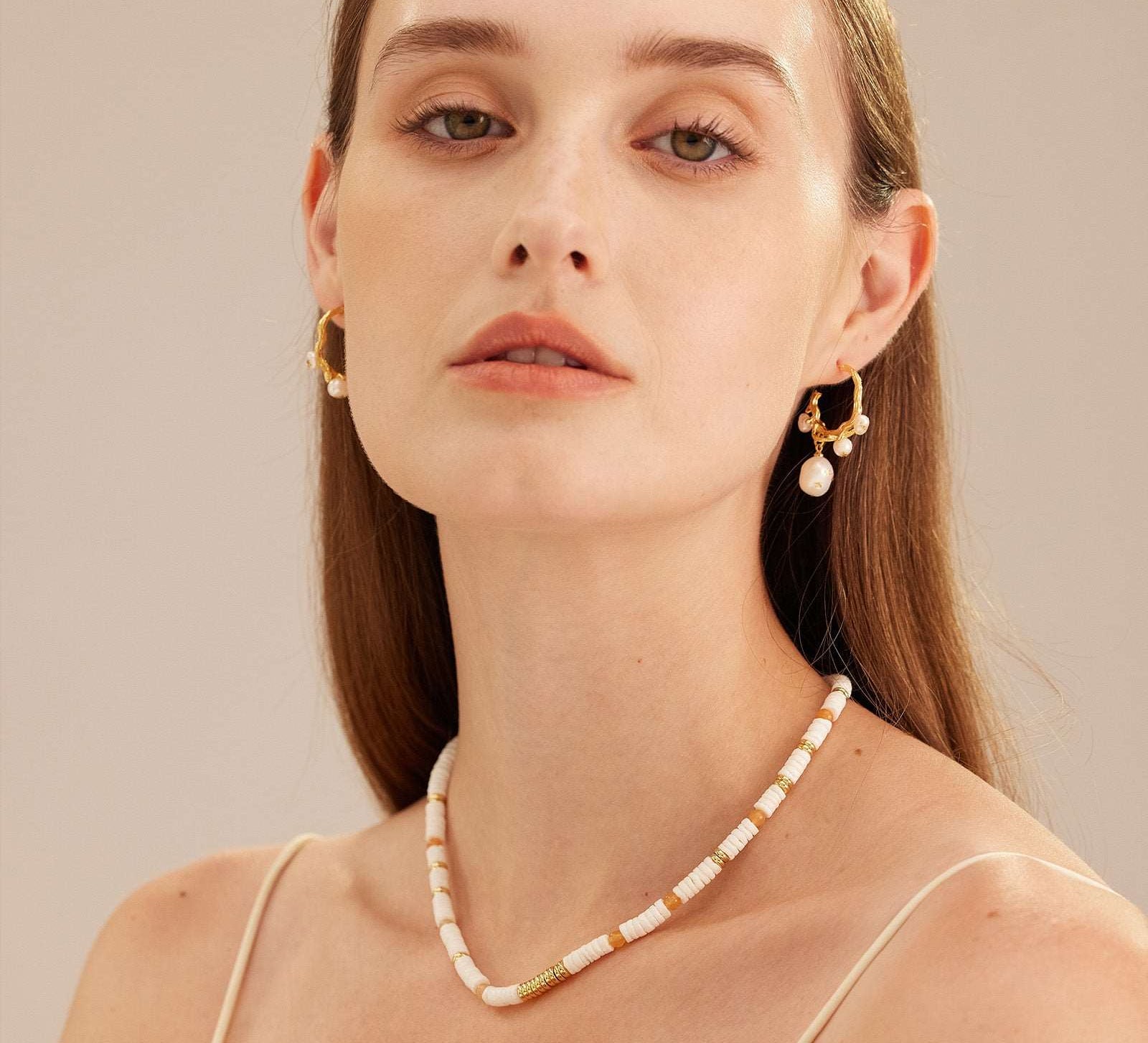 Baroque Pearl Drop Earrings, featuring lustrous baroque pearls as captivating charms, adding a touch of natural beauty and individuality to your ear ensemble