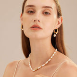 Baroque Pearl Drop Earrings, featuring lustrous baroque pearls as captivating charms, adding a touch of natural beauty and individuality to your ear ensemble