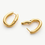 Tunnel Hoop Earrings in Chic Gold, featuring chic loops of gold, these earrings enhance your style with a modern and fashionable flair, perfect for any occasion