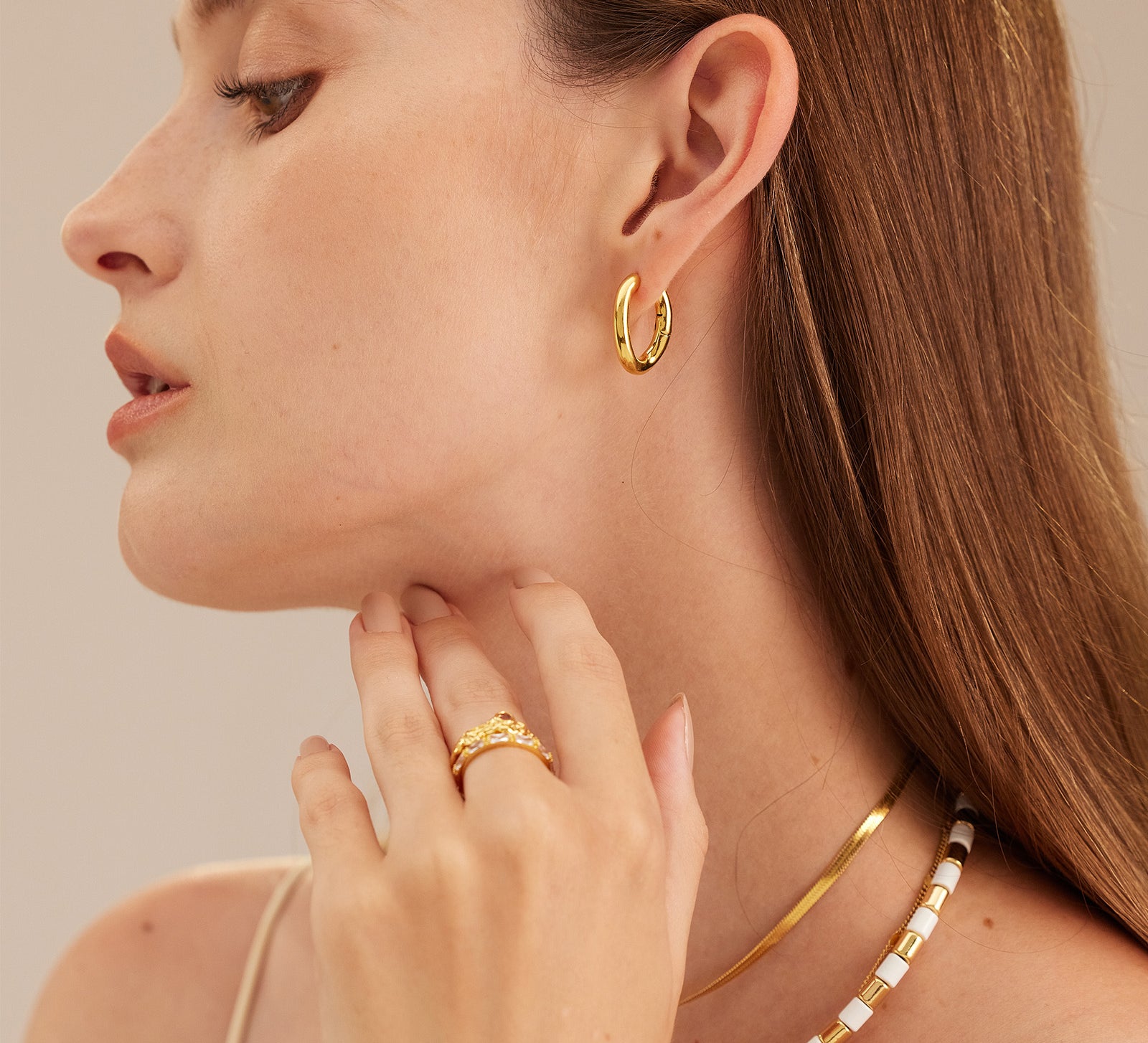 Gold Tunnel Hoop Earrings, making regal statements with their golden allure, these hoops bring an air of sophistication and grandeur to your ear jewelry collection.