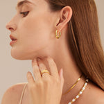 Gold Tunnel Hoop Earrings, making regal statements with their golden allure, these hoops bring an air of sophistication and grandeur to your ear jewelry collection.