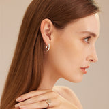 Silver Tunnel Hoop Earrings creating an eternal circlet of silver, these hoops offer a classic and versatile accessory that complements any outfit with timeless grace