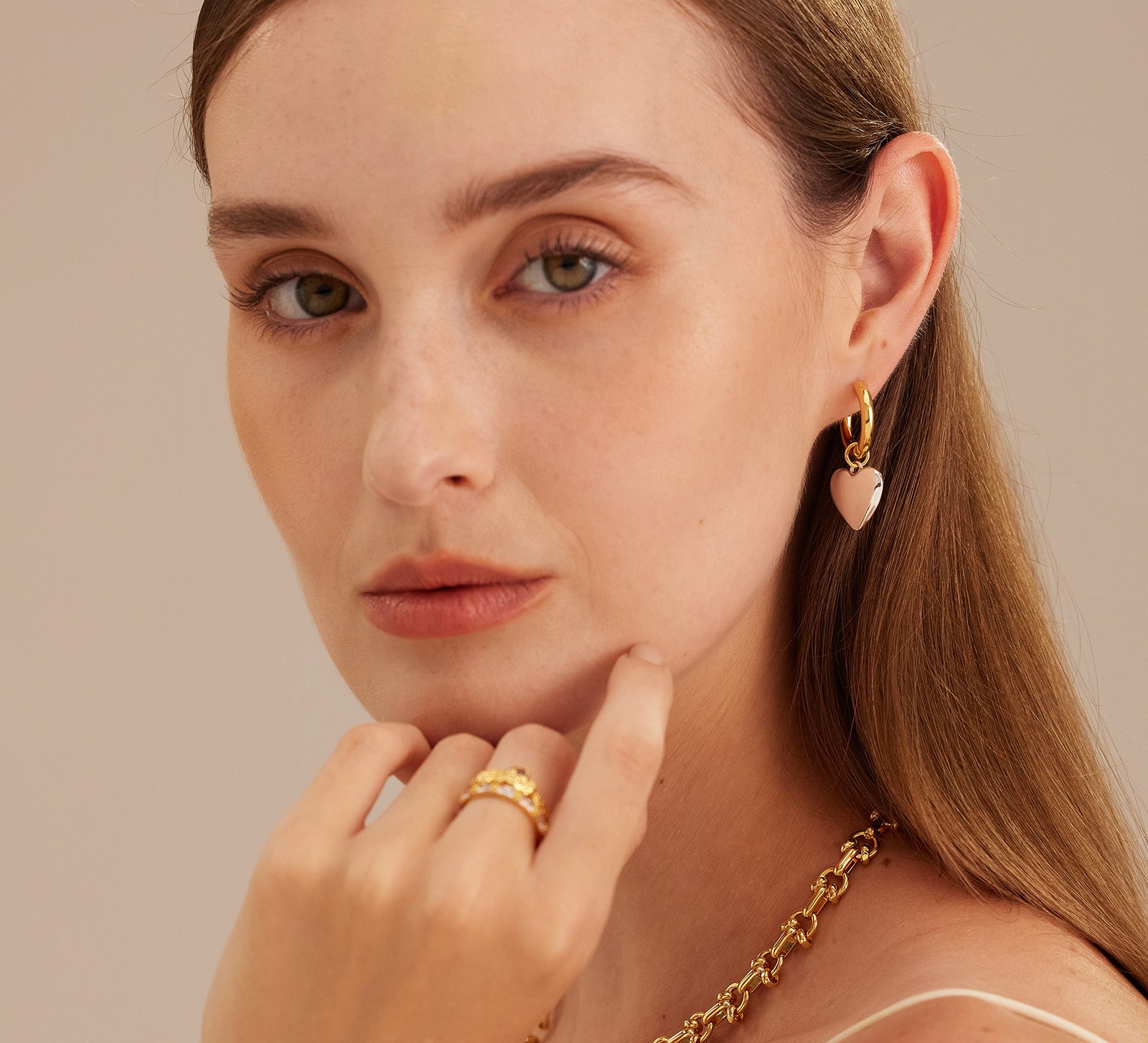  Hoop Earrings featuring heart-shaped tunnels, a love-infused design that exudes romance and sweet sentiment in every twist