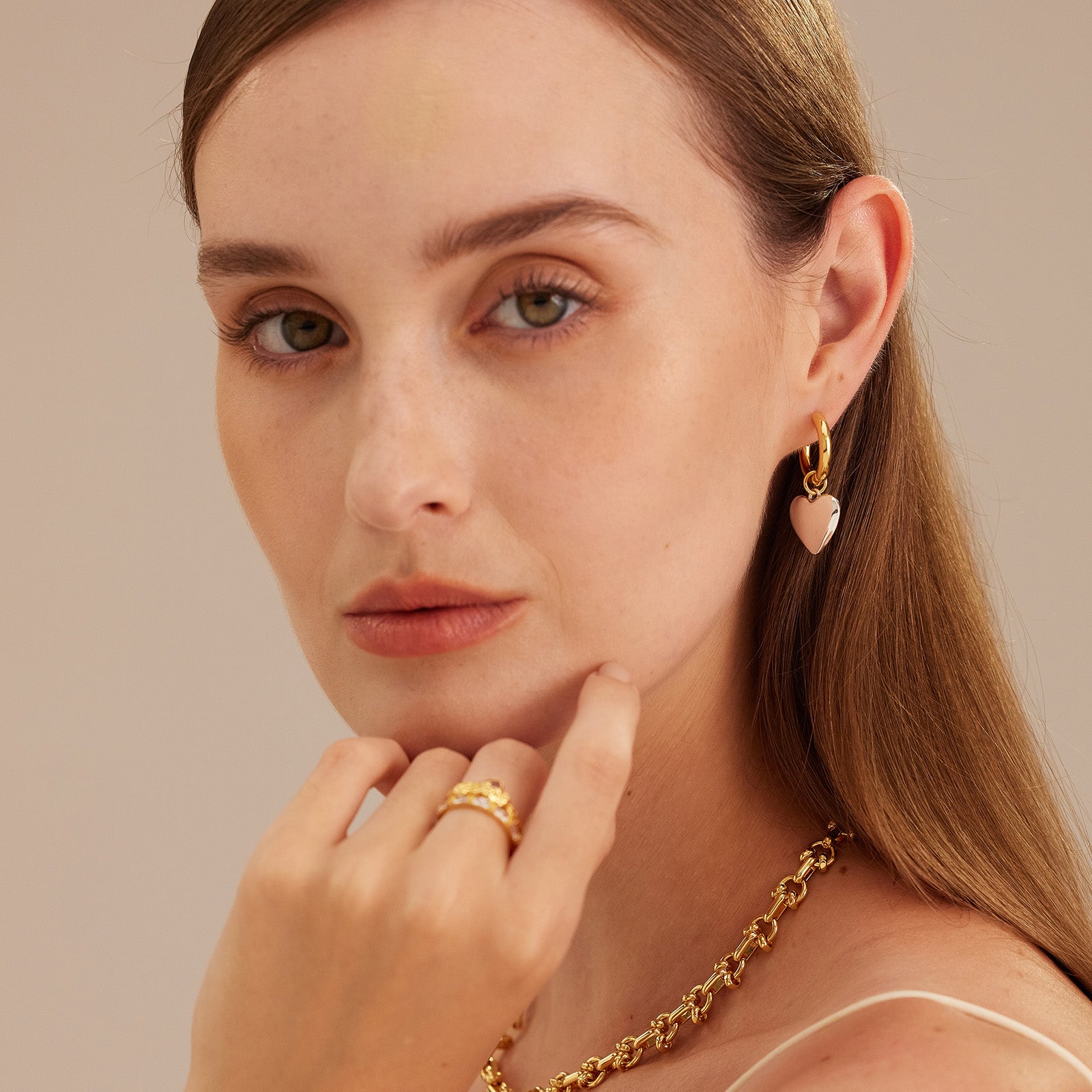  Hoop Earrings featuring heart-shaped tunnels, a love-infused design that exudes romance and sweet sentiment in every twist