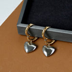  Heart Tunnel Hoop Earrings, whimsically designed with heart-shaped cutouts for an enchanting and whimsical addition to your jewelry collection