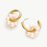 Seed Pearls Tunnel Hoop Earrings, showcasing lustrous pearls in a tunnel design, a symbol of refined beauty and grace