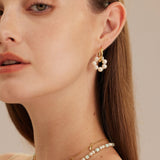 Seed Pearls Tunnel Hoop Earrings, featuring a cascade of tiny pearls, creating a lavish and opulent look for a glamorous appeal