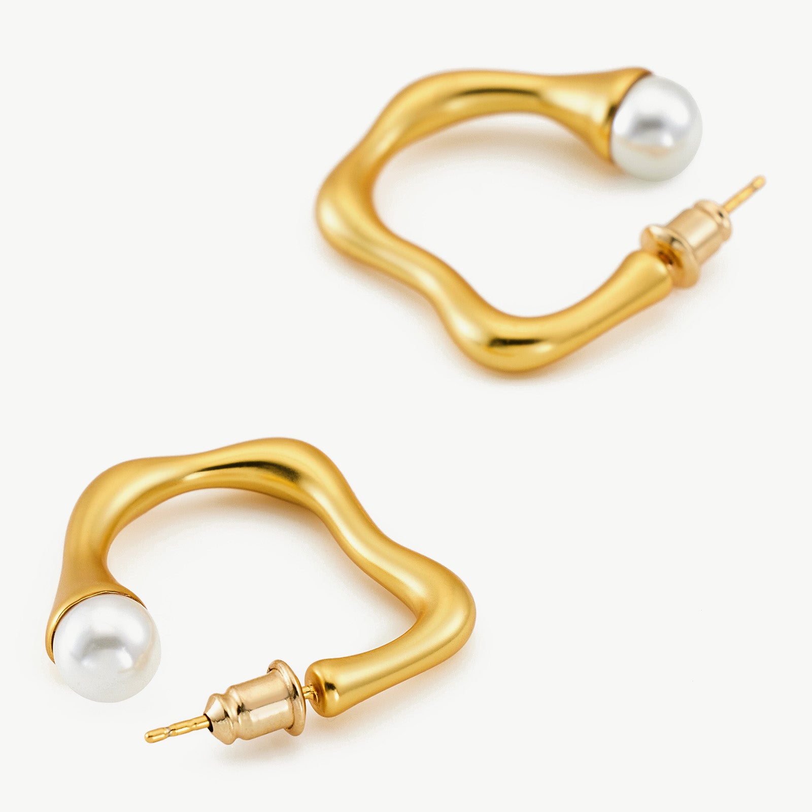 Large Hoop Earrings featuring a squiggle wavy pattern, a modern and artistic choice that showcases contemporary flair