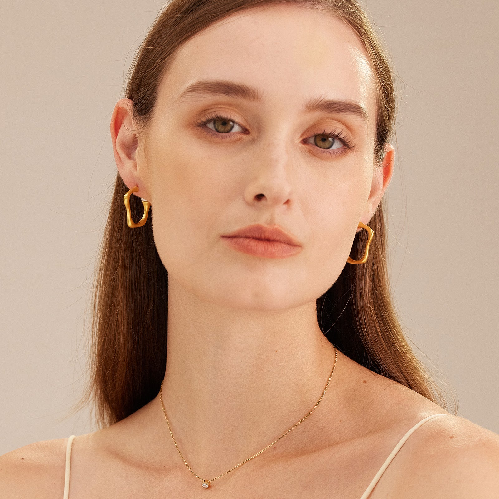 Squiggle Wavy Large Hoop Earrings, a glamorous and stylish accessory that adds a playful twist to the classic hoop design.