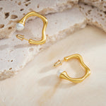 Large Hoop Earrings with a dynamic squiggle wavy motif, creating a visually captivating and sophisticated accessory.