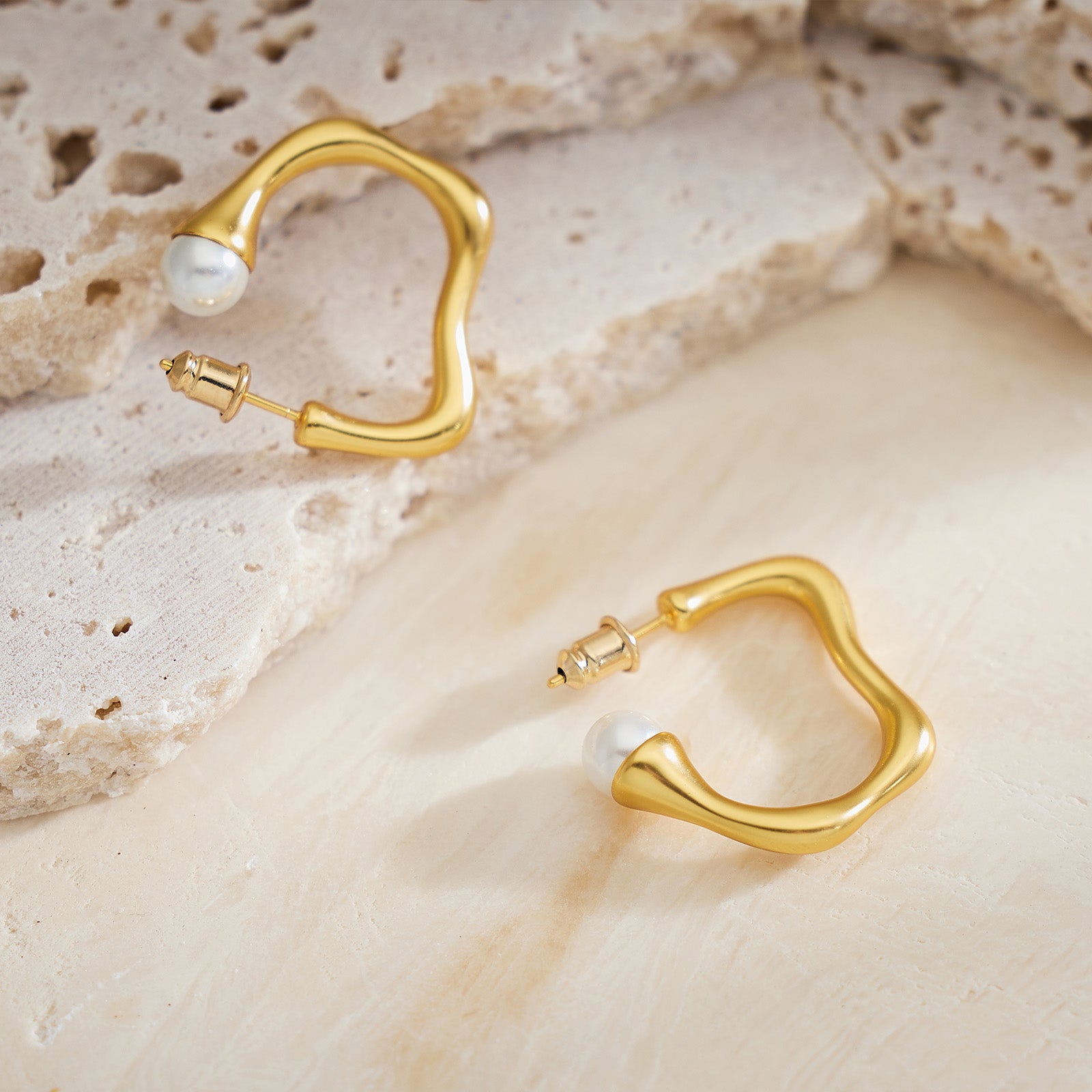Large Hoop Earrings with a dynamic squiggle wavy motif, creating a visually captivating and sophisticated accessory.