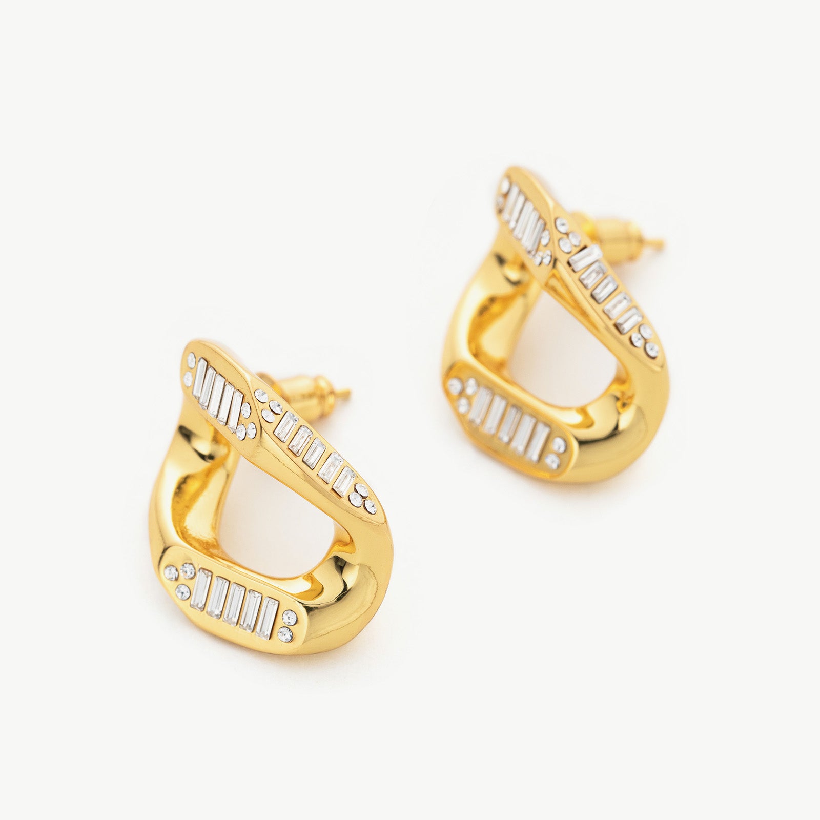 Gold Crystal Wavy Stud Earrings, a stylish and sunlit accessory that captures the essence of elegance and warmth.