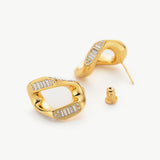 Crystal Wavy Stud Earrings in gold, a timeless and versatile pair that effortlessly elevates your everyday or evening look