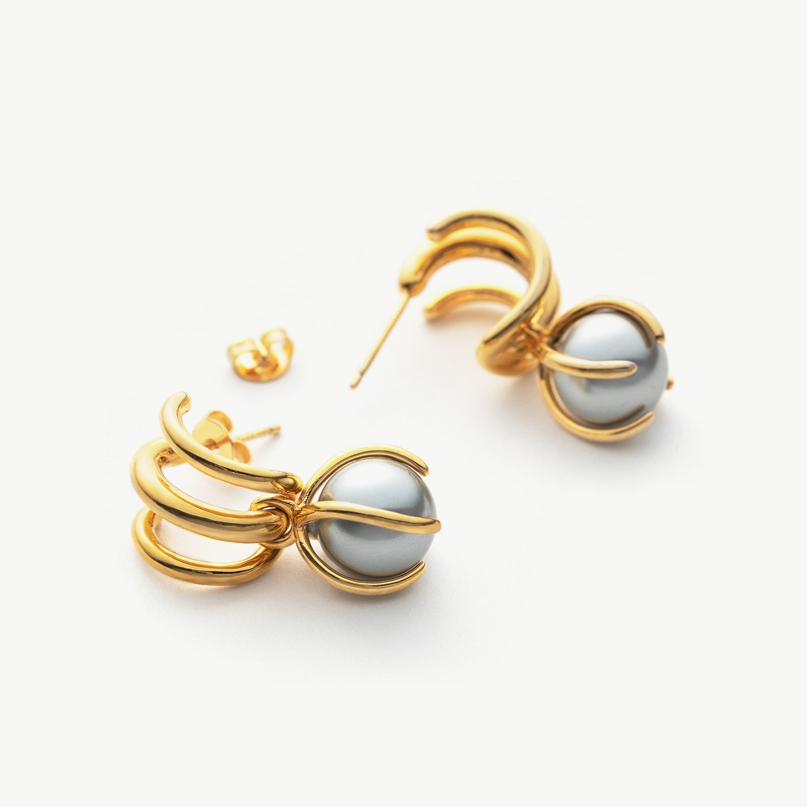  Fine Pearl Earrings with sculpted pearl accents, these hoops provide a unique and artistic charm, capturing attention with their timeless beauty and intricate details