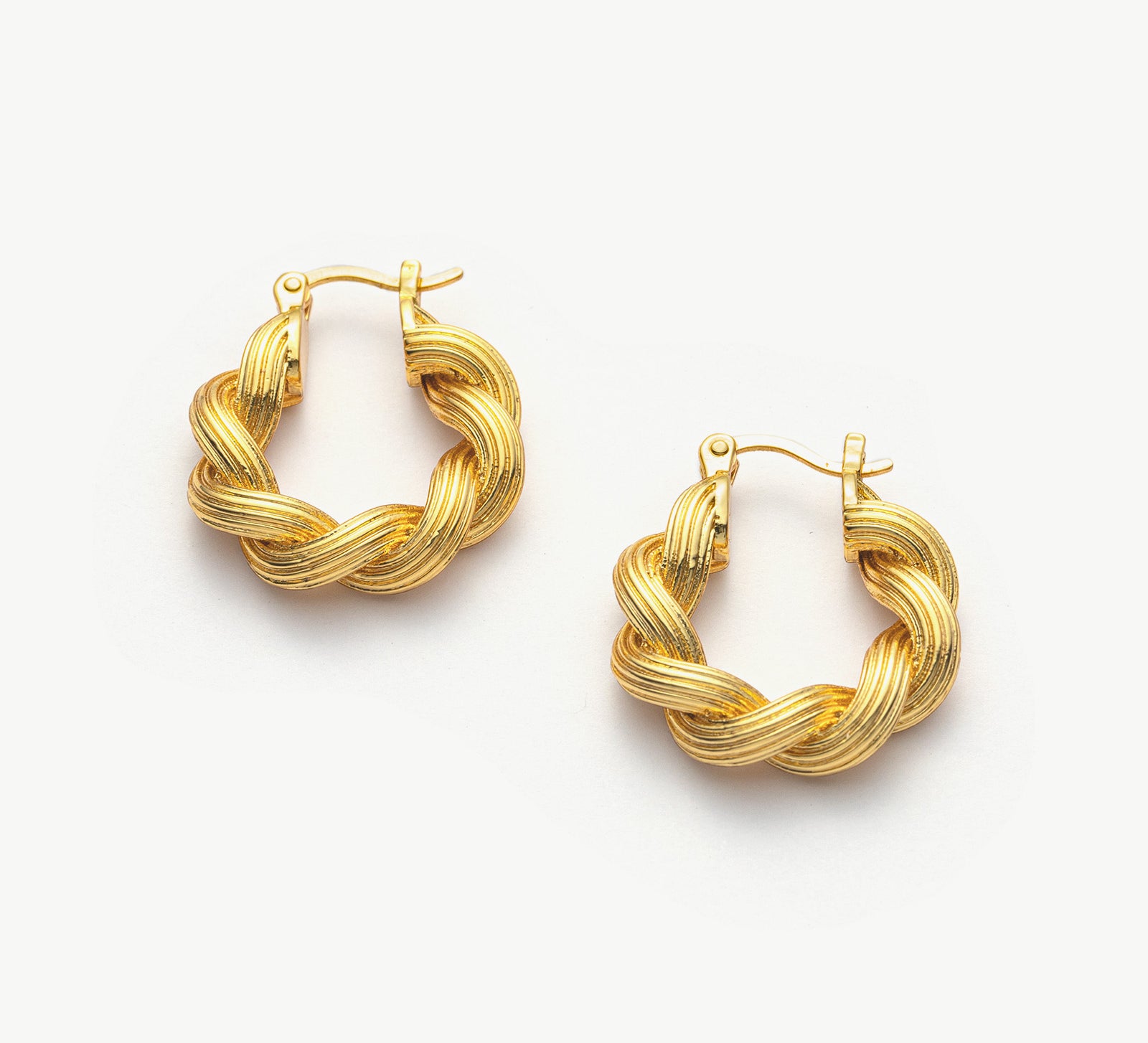 Double Rope Hoop Earrings making dynamic statements with their textured design, these hoops offer a stylish and eye-catching accessory for any occasion