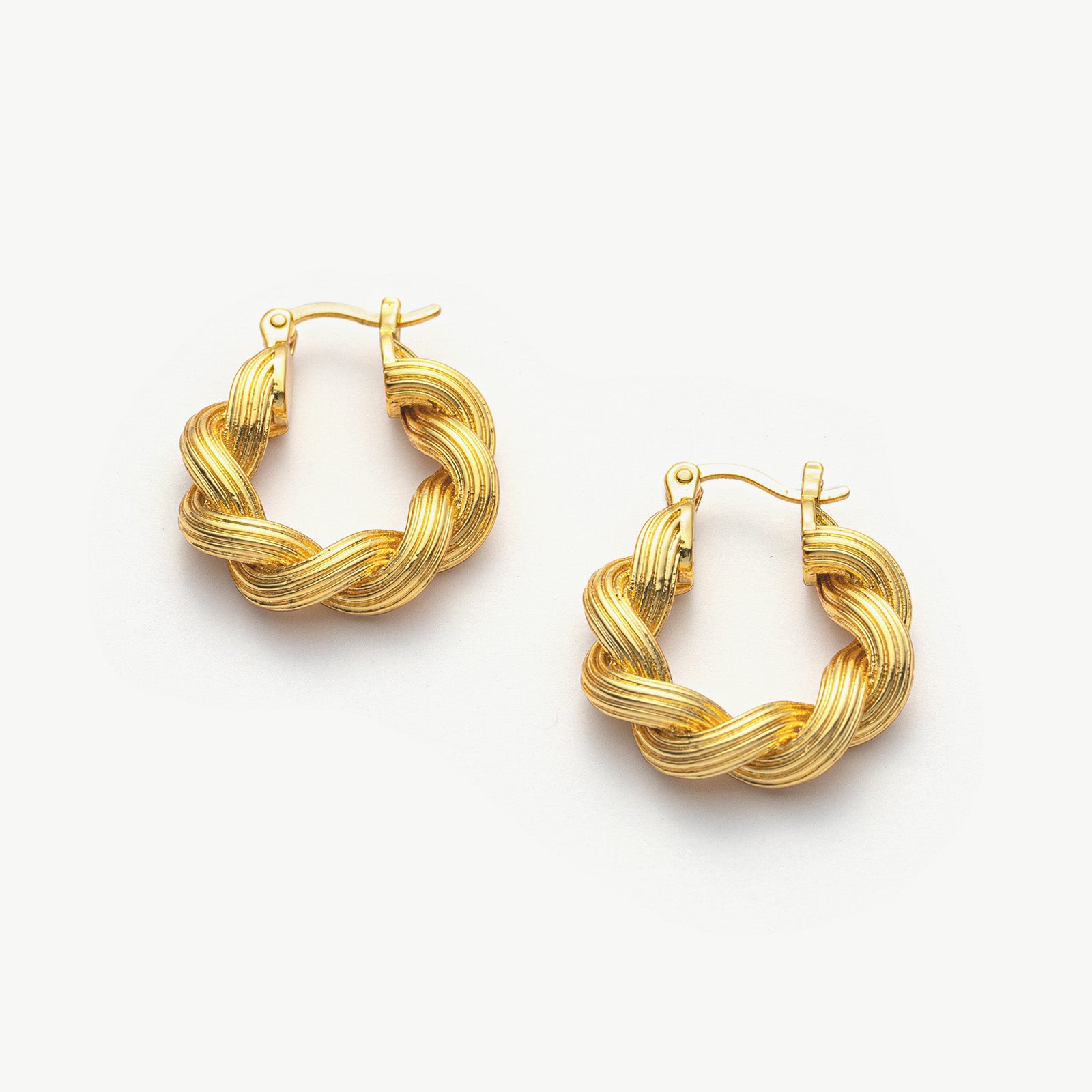 Double Rope Hoop Earrings making dynamic statements with their textured design, these hoops offer a stylish and eye-catching accessory for any occasion