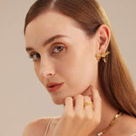 Crystal-adorned Butterfly Stud Earrings, a dazzling pair that brings a sense of elegance and nature-inspired charm to your look