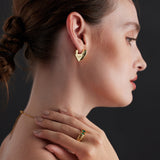 Heart Hoop Earrings in Gold, a radiant and elegant accessory featuring heart-shaped hoops that embrace your style with a touch of warmth and luxury