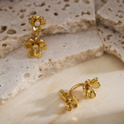 Double Flowers Charm Hoop Earrings, a chic and garden-inspired accessory that effortlessly elevates your fashion with floral charm.