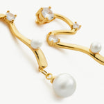  Serpent Pearl Drop Earrings, showcasing intricately sculpted serpent charms paired with lustrous pearl drops, creating a mesmerizing and artistic accessory