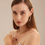 Serpent-Inspired Pearl Drop Earrings, featuring a unique twist with serpent motifs, these earrings add a touch of mystique and timeless beauty to your ensemble