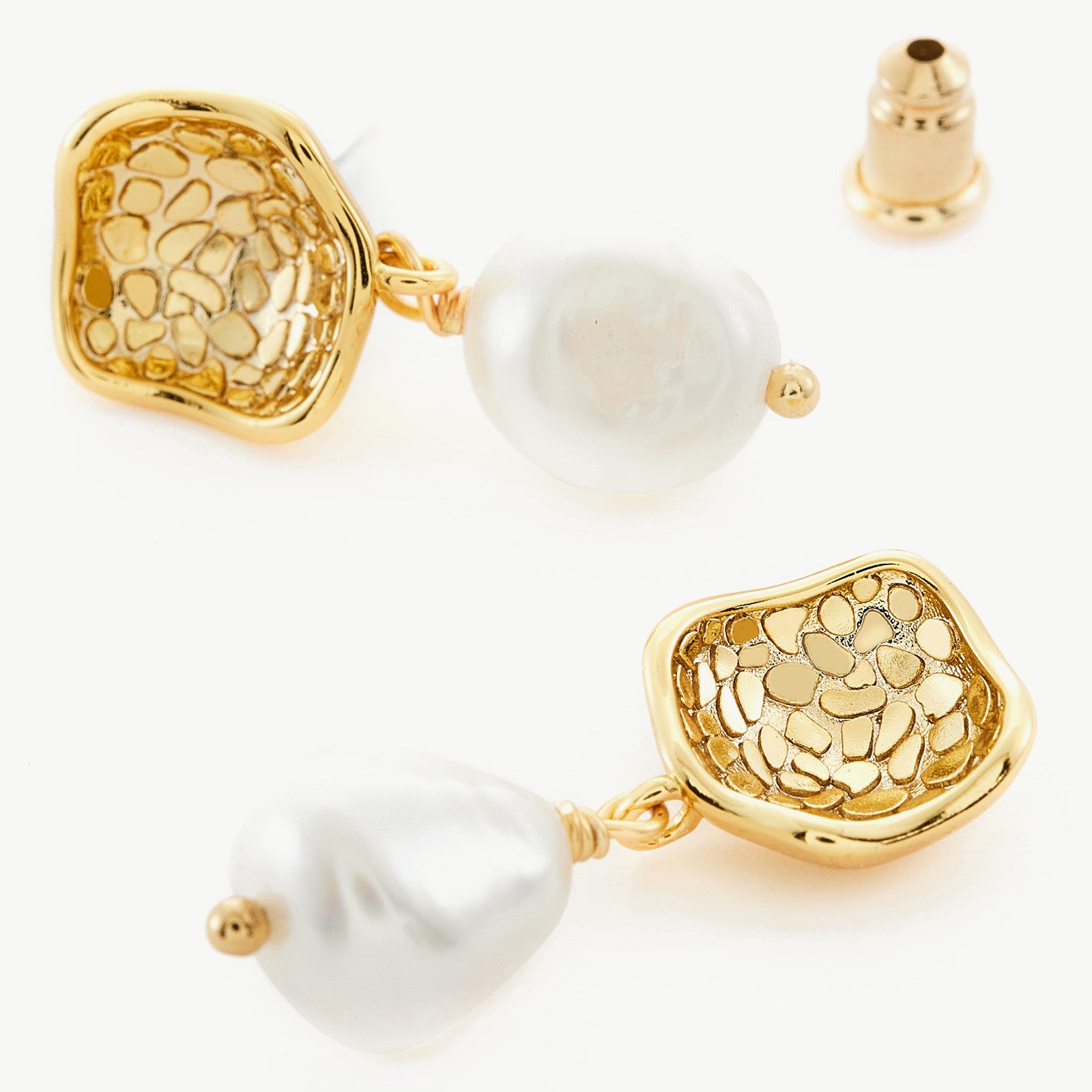 Molten Baroque Pearl Drop Earrings with sculpted details, these earrings provide a splendor of sculptural beauty, capturing attention with the exquisite combination of molten metal and baroque pearls