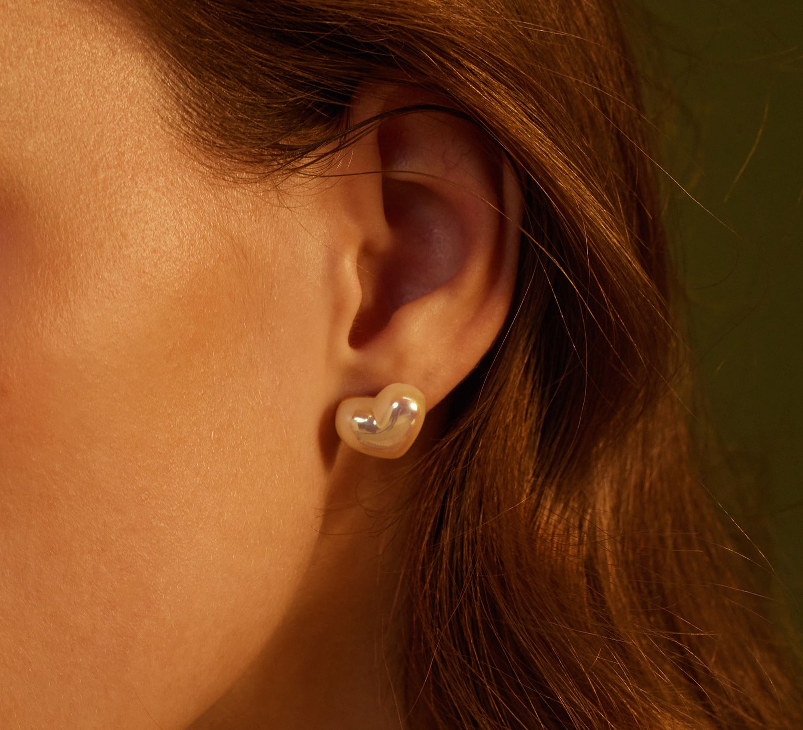 Heart-shaped Stud Earrings, a versatile and stylish pair that effortlessly complements your everyday look with a hint of romance